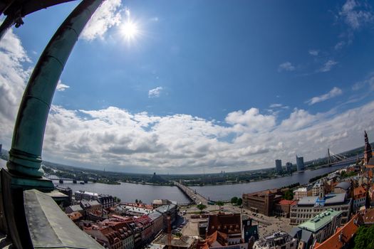 Fisheye aerial view of Riga city from st. Peter's church in Latvia. Panoramic view of Riga with cloudy blue sky. Fisheye lens.