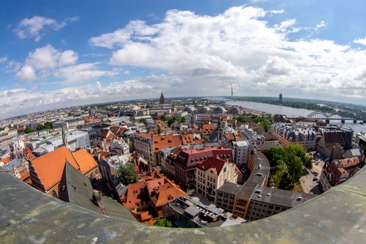 Fisheye aerial view of Riga city from st. Peter's church in Latvia. Panoramic view of Riga with cloudy blue sky. Fisheye lens.