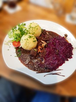 Gourmet game fillet with potato dumplings, goulash garnished