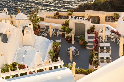 Typical view of Fira village patios at sunset, Santorini island, Greece