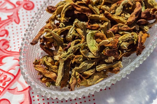 a closeup food shoot to dried peppers with corner of ellipsis plate. photo has taken at a village at turkey.