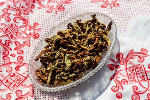 a upper view closeup food shoot to dried peppers in ellipsis plate. photo has taken at a village at turkey.