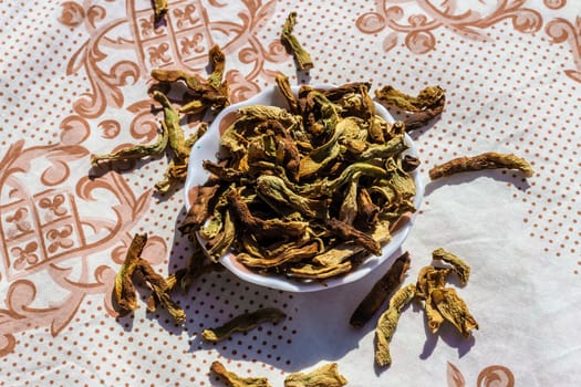 an upper view closeup food shoot to dried peppers with round bowl. photo has taken at a village at turkey.