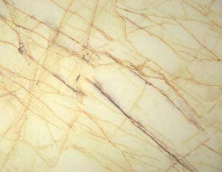 Northern marble of light beige color with yellow veins.Close-up