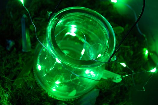 Magic cauldron, green background, moss, firefly, fog smoke bokeh close-up