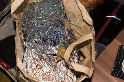 Dispose of Christmas waste. Tinsel in the trash