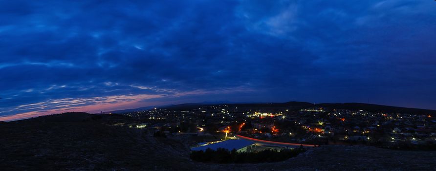 A stunning view before sunrise, valley and mountains on the horizon and blue sky at very early morning.