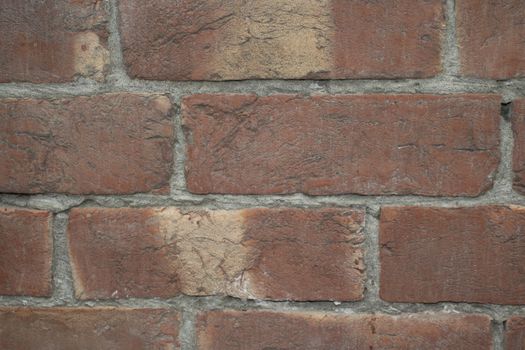 Destroyed brick wall, red texture grunge background