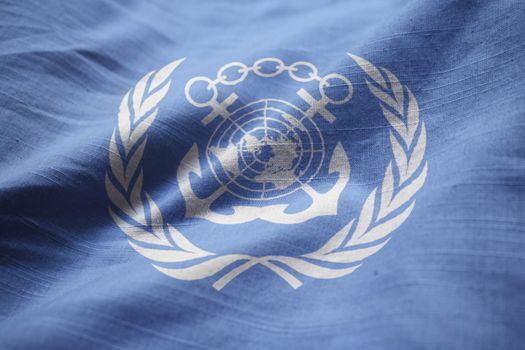 Closeup of Ruffled International Maritime Organization Flag, International Maritime Organization Flag Blowing in Wind