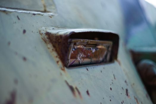 Damaged body of a military armored infantry. Parts of looking triplex device. Outdoor military vehicles museum. Armor is damaged at the battlefield.