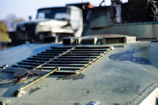 Damaged body of a military armored infantry. Part of  vehicle on photo. Outdoor military vehicles museum. Armor is damaged at the battlefield.