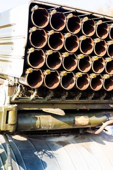 Missile firing system on military armored truck close up view. Rocket launcher closeup.