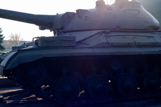 Parts of the hull of the old tank in the museum of military vehicles outdoor in the open air. Gun and truck parts closeup view.