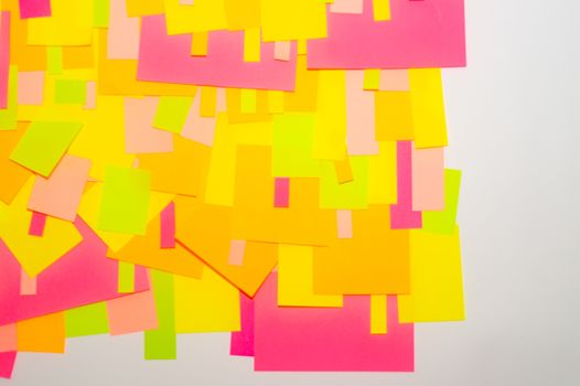 Bright multi-colored stickers on the office white board.