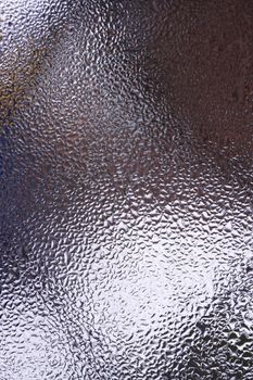 Water drops on glass window close up with blurred background. Drops in macro. Condensate on window closeup. Wet air.