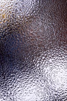 Water drops on glass window close up with blurred background. Drops in macro. Condensate on window closeup. Wet air.