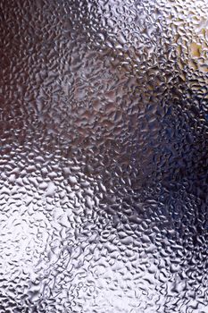 Water drops on glass window close up with blurred background. Drops in macro. Condensate on window closeup. Wet air.