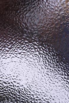 Water drops on glass window close up with blurred background. Drops in macro. Condensate on window closeup. Wet air.