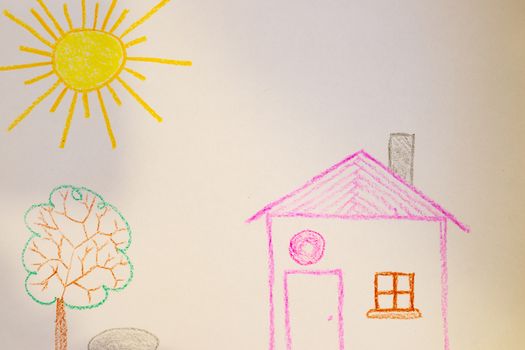 Children`s drawing of house, tree, sun and rock on white paper. Kindergarten age drawings.