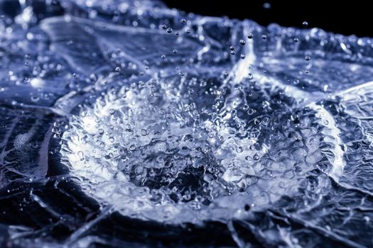 Water drops splashing on acoustic membrane. A lot of drops in air. High frequency of sound waves. Water cloud small drops. Frozen time shot.