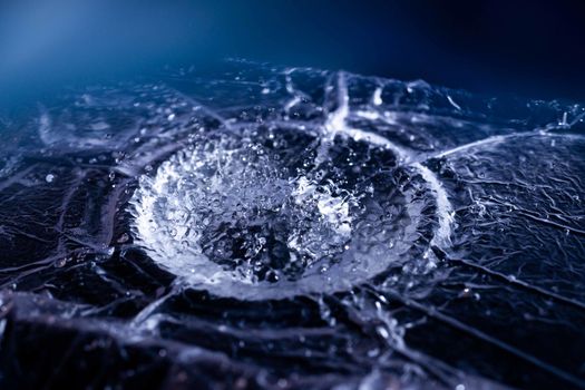 Water drops splashing on acoustic membrane. A lot of drops in air. High frequency of sound waves. Water cloud small drops. Frozen time shot.