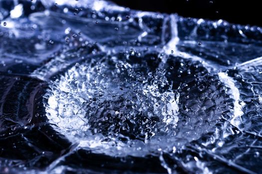 Water drops splashing on acoustic membrane. A lot of drops in air. High frequency of sound waves. Water cloud small drops. Frozen time shot.