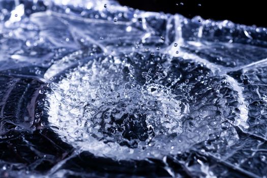 Water drops splashing on acoustic membrane. A lot of drops in air. High frequency of sound waves. Water cloud small drops. Frozen time shot.