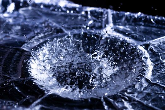Water drops splashing on acoustic membrane. A lot of drops in air. High frequency of sound waves. Water cloud small drops. Frozen time shot.