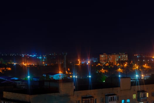 Long exposure night photo. A lot of stars with trees on foreground. Far from the city. Night landscape.
