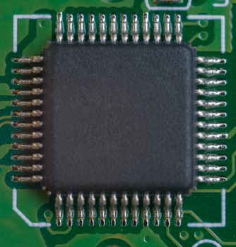 One big microscheme on motherboard with many legs. close-up view.