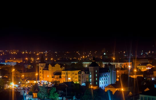 Long exposure photo big city life at night. High view above the city.