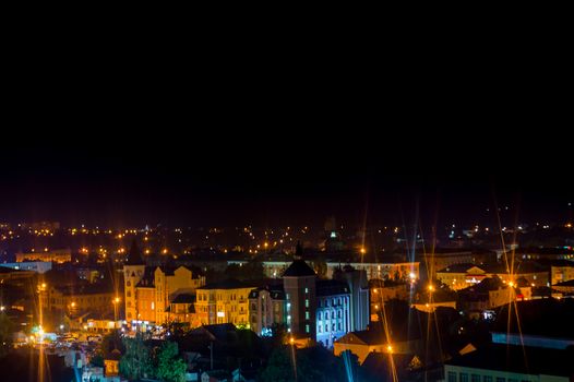 Long exposure photo big city life at night. High view above the city.