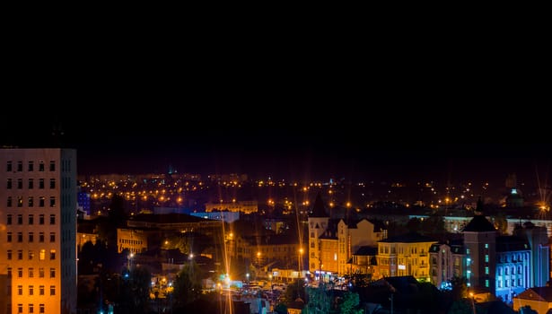 Long exposure photo big city life at night. High view above the city.
