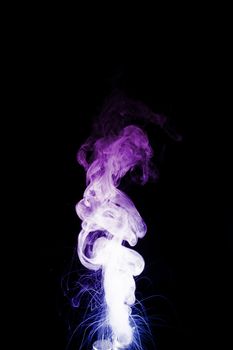 Column of vape clouds splash on black background. A lot of lines of smoke. Two colours fog is blue and purple. Stock isolated color smoke with spray boiling liquid.