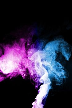 Colored clouds of vape smoke. A lot of colour and glicerine clouds, red and blue colours. Stock photo isolated on black background with boling spray of vaping liquid. Vape culture and no smoking movement.