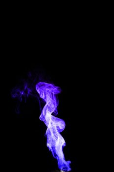 Dual colour vape steam column with spray boiling liquid. Blue and purple colour smoke. Stock photo isolated on black background.