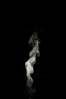 Vape steam column with spray boiling liquid. Stock photo isolated on black background.