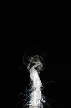 Splash of glicerine clouds and boiling flowing liquid lines. Vape culture and no smoking movement.