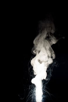 Column of vape clouds splash on black background. A lot of lines of smoke. White fog is tight. Stock isolated white smoke with spray boiling liquid.