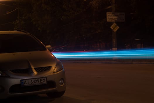 Long exposure vehicle lights in city. Direct light lines. Editorial use only.