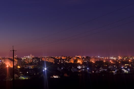 Long exposure night photo. A lot of stars with trees on foreground. Far from the city. Night landscape.