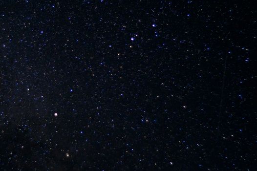 Long exposure night photo. A lot of stars with constellations. Far from the city. Night landscape.