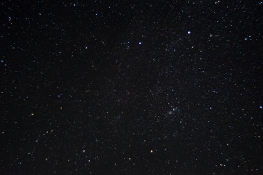 Long exposure night photo. A lot of stars with constellations. Far from the city. Night landscape.