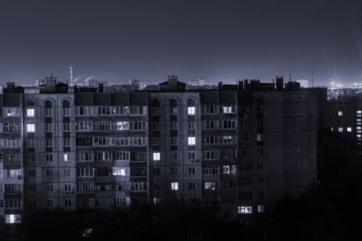 Night long exposure photo 9 and 10 floors high-rise buildings in black and white colours. Big city life is here!