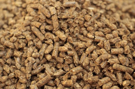 Fuel wood pellet close-up. A source of alternative clean energy. A lot of pellet. Natural fuel and energy of future.