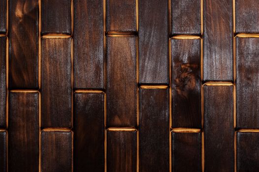 Wooden charred floor of small plates. View from above. Floor as an element of the interior.