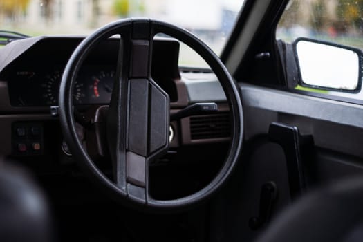 USSR 1980`s old car. Wheel, mirror and digital panel in frame. Retro car born in USSR.