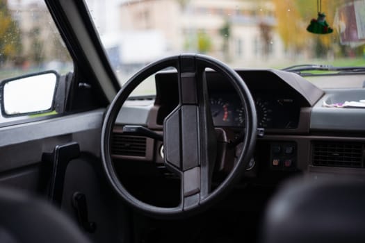 USSR 1980`s old car. Wheel, mirror and digital panel in frame. Retro car born in USSR.