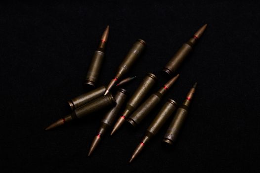 Rifle military ammo on black background. Symbolizes war for money- biggest problem in world.