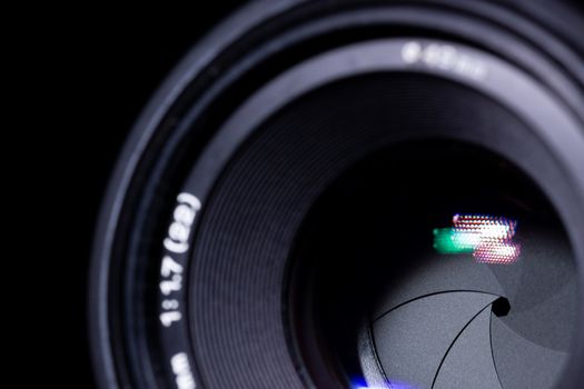 Lens aperture low light photo. closeup. Aperture blades is clean and dark. Stock photo isolated on black background.